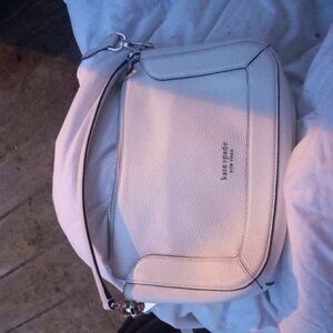 A white Kate spade crossbody bag